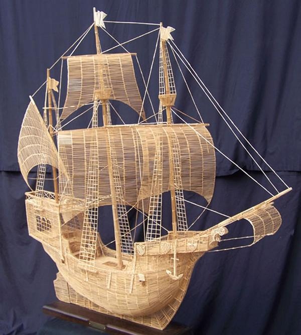 a wooden model of a sailing ship