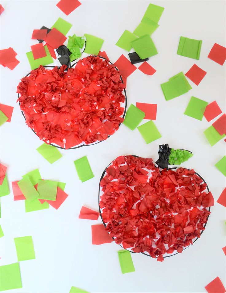 two apples made out of red and green paper