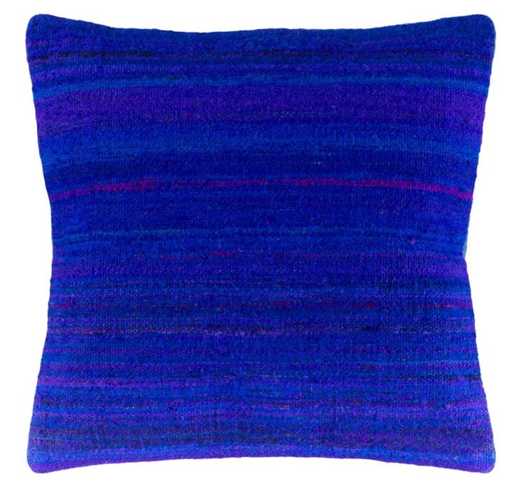 a purple and blue pillow on a white background