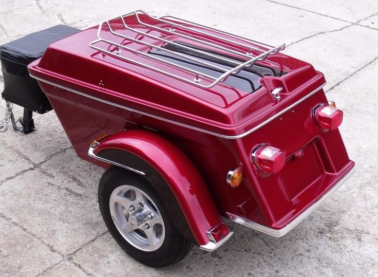 a red motorcycle with a cage on the back