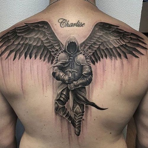 a man with an angel tattoo on his back