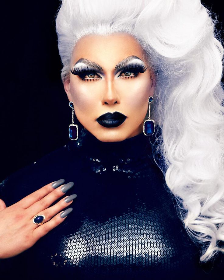 a woman with white hair and black makeup