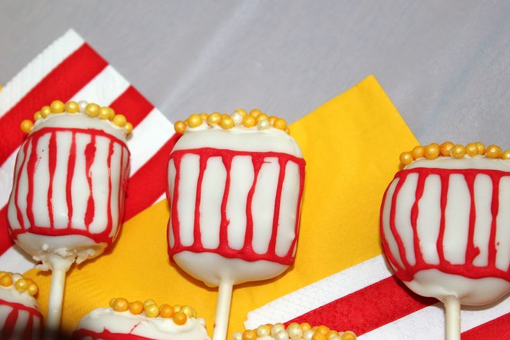 three candy lollipops with white and red stripes