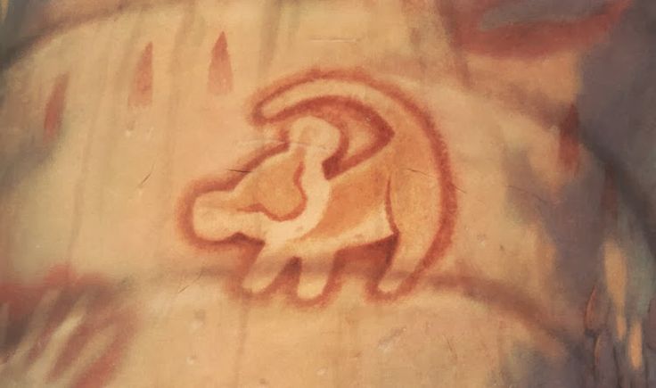 an animal carved into the side of a wall