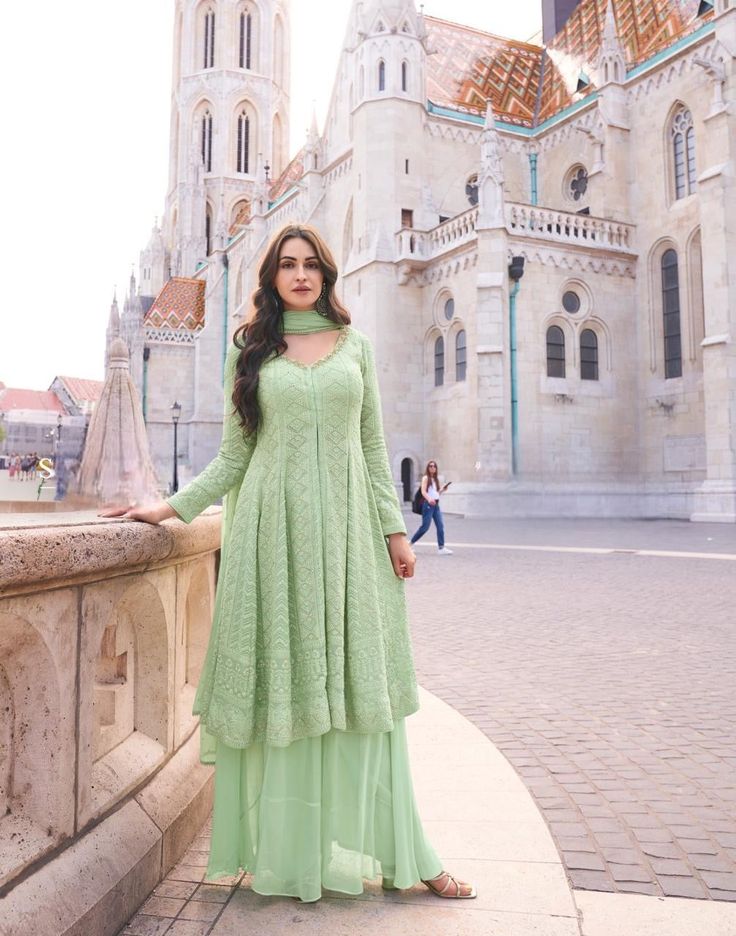 Mint green flared top with palazzo and dupatta Traditional Green Floor-length Palazzo Set, Bollywood Style Green Semi-stitched Palazzo Set, Semi-stitched Green Bollywood Palazzo Set, Anarkali Style Floor-length Pista Green Palazzo Set, Long Sleeve Pista Green Georgette Palazzo Set, Designer Green Palazzo Set For Festive Occasions, Festive Green Palazzo Set With Dupatta, Designer Green Palazzo Set With Dabka, Designer Green Dabka Palazzo Set