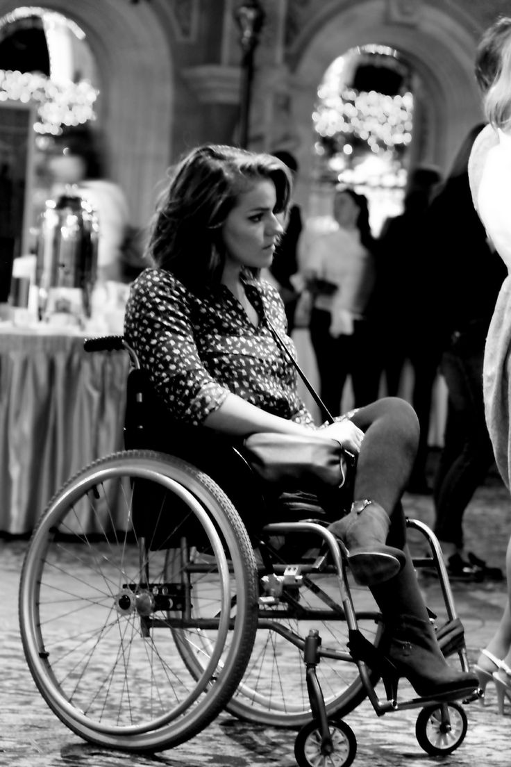 two women in wheelchairs talking to each other