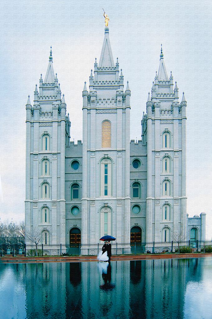 an image of a large building that is reflecting in the water