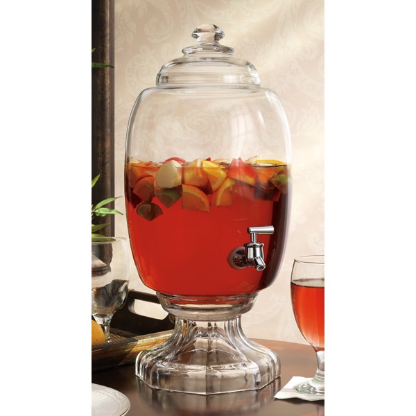 a glass container filled with liquid and fruit