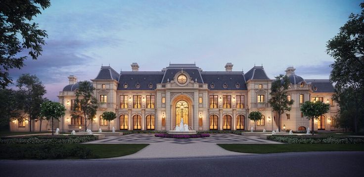 a large building with lots of windows and lights on it's front entrance is lit up at night