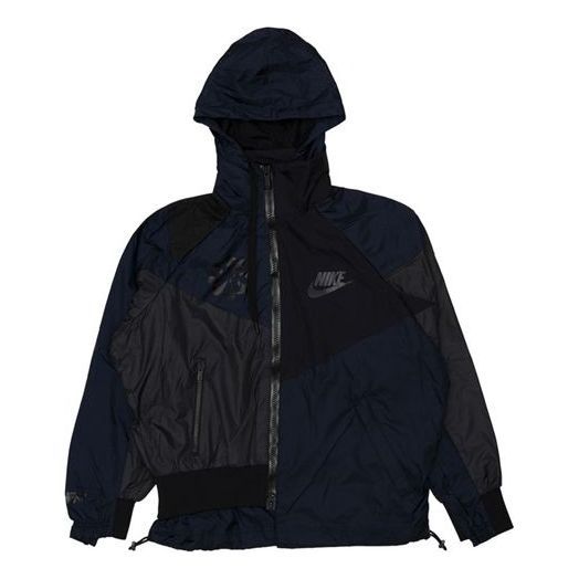 Black Nike Nylon Hooded Jacket, Nike Nylon Athleisure Hooded Jacket, Nike Nylon Track Jacket With Pockets, Nike Nylon Hooded Jacket In Athleisure Style, Nike Athleisure Nylon Hooded Jacket, Nike Nylon Windbreaker For Outdoor, Nike Windbreaker With Adjustable Hood For Outdoor, Nike Outdoor Windbreaker With Adjustable Hood, Black Patchwork Hooded Jacket