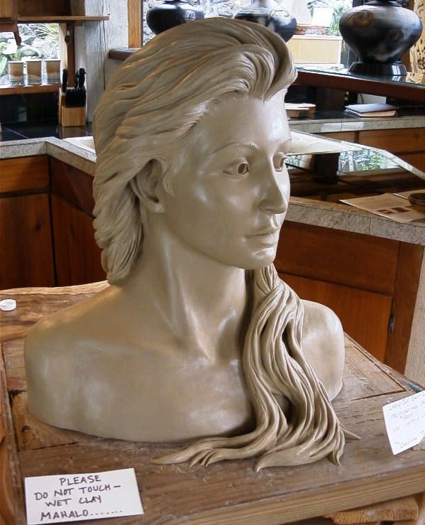 a statue of a woman with long hair