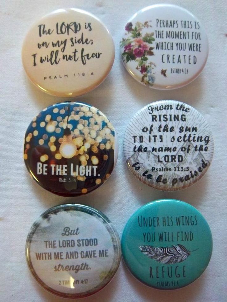 six buttons with different sayings on them