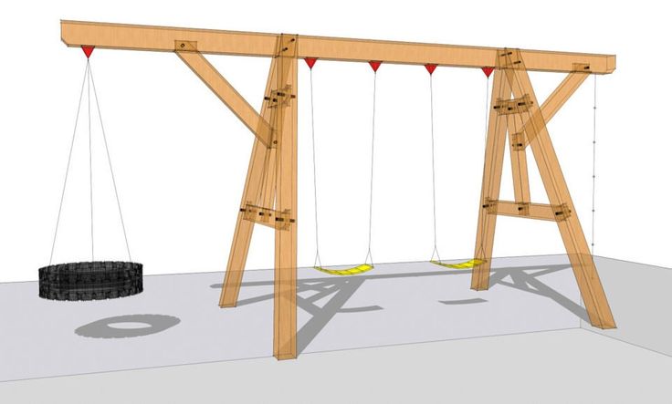 a wooden swing with two tires on it