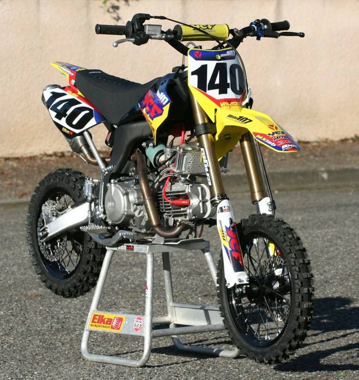 a dirt bike parked on top of a metal stand