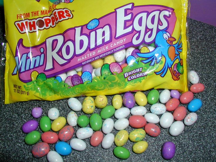 a bag of mini robin eggs sitting on top of a counter next to some candy