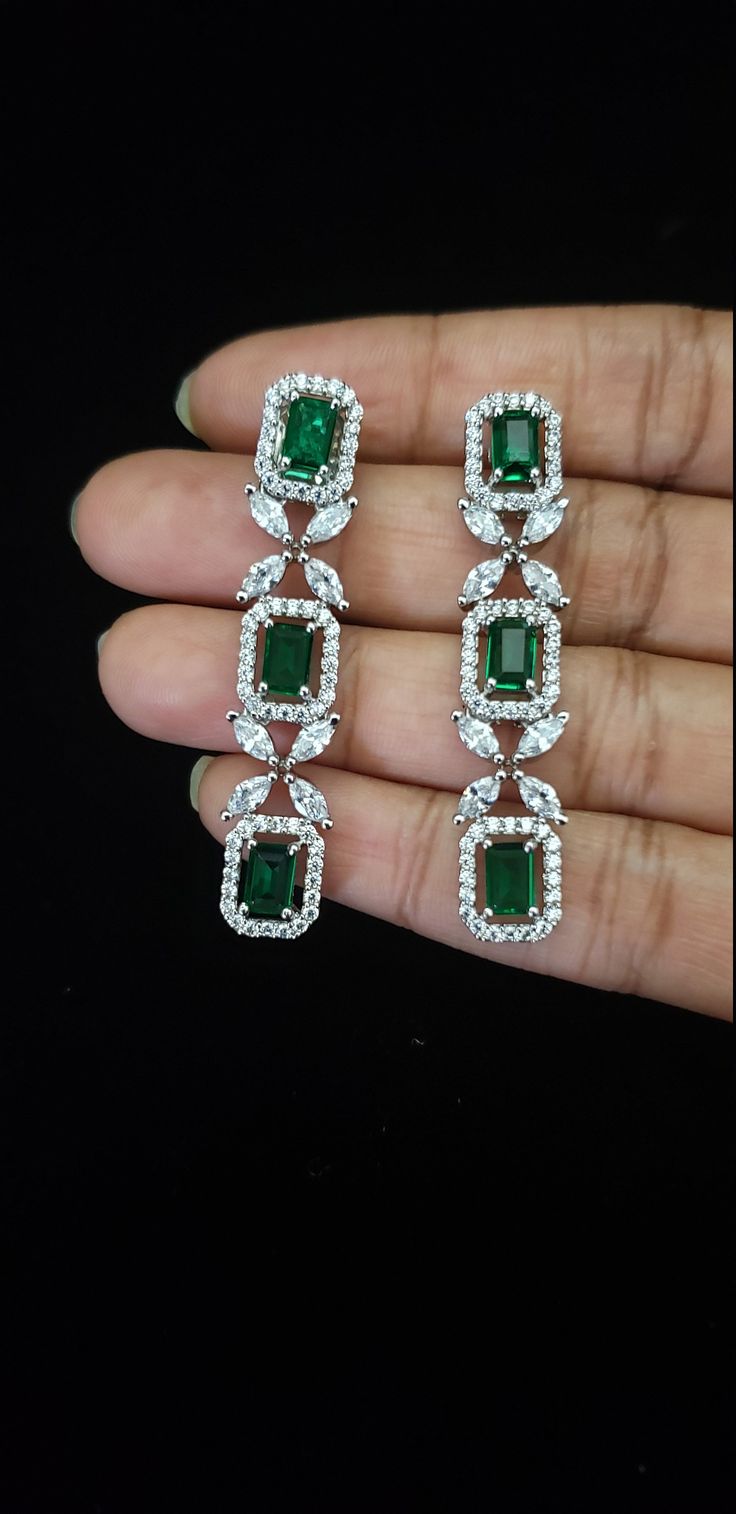 "Handmade Indian Jewelry item * Stunning Hand made Traditional Emerald jewelry set. * Necklace Set is a combo of Necklace & Stud Earrings * Necklace is adjustable with adjustable back chain/ Dori/ Cord * Main Necklace Length: 9.5\", Back Extension :8\"; *, Earring Length: 2\", Earring Width: 0.6\" * Packed in a box, Ideal For GiftingOn Request, We Can Add A Custom Message For Your Loved One (At No Additional Cost) :) Color, shades, texture displayed may slightly vary from the actual product Wedding Drop Earrings With Stones, Silver Wedding Earrings With Stones, Wedding Earrings With Stones, Cubic Zirconia Jewelry Sets With Dangle Earrings, Green Stone Wedding Earrings, Fine Jewelry Stone Earrings For Weddings, Fine Jewelry Earrings With Stones For Wedding, Green Stone Earrings For Wedding, Cubic Zirconia Stone Earrings For Wedding