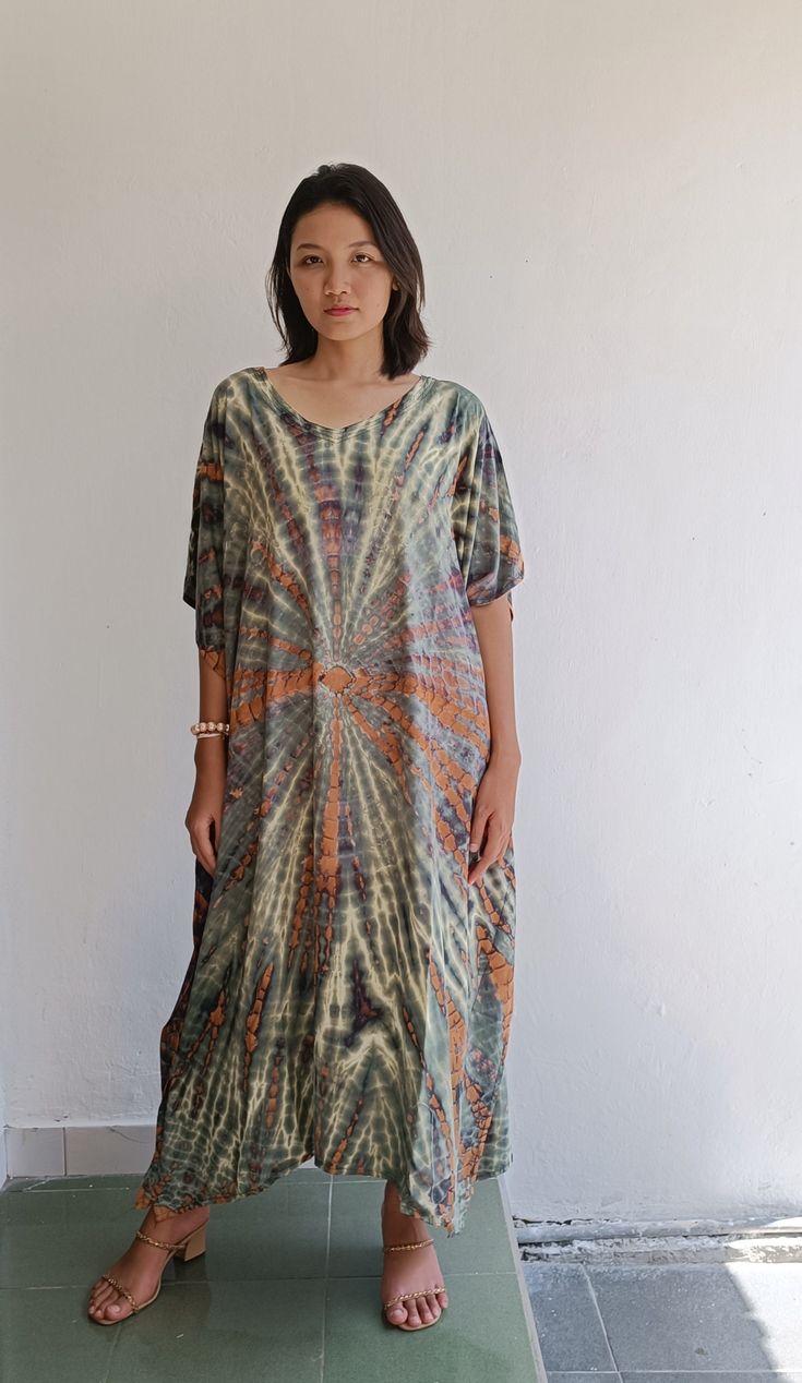 Matahari Kaftan Dress Made with lightweight and breathable rayon, loose and easy fit with an eye catching color blocking, this kaftan perfect for every occasion.  ◇ Color - Tie dye - green and brown ◇ Size One size lenght : 116 cm/ 45.6 inch chest : 166cm/ 65,3 inch US Women size from S To XXL (small to plus size ) ◇ Nagia style model  Her height is 170 cm  Weight is 50 cm  Made from soft rayon Hand cool wash At first, you may smell the unique print and dye. It will disappear after you wash it. Hippie Multicolor Kaftan With Kimono Sleeves, Bohemian Flowy Loose Maxi Dress, Hippie Beach Cover-up Dress With Kimono Sleeves, Bohemian Tunic Dress Relaxed Fit, Bohemian Loose Summer Dresses, Bohemian Relaxed Fit Tunic Dress, Summer Bohemian Loose Dress, Oversized Bohemian Printed Dress, Free Size Bohemian Rayon Dress