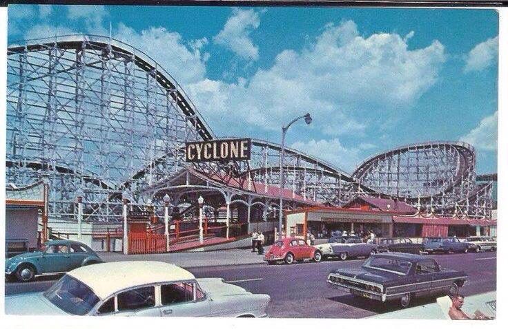 an amusement park with cars and roller coasters