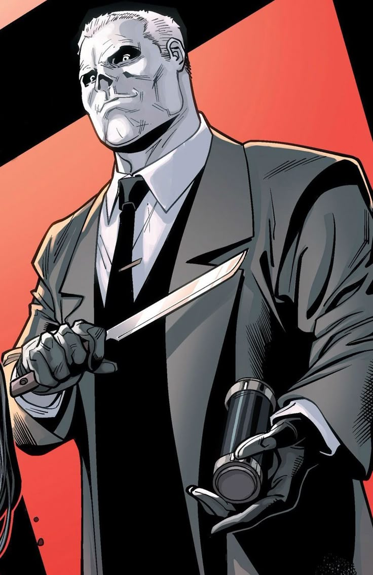 a man in a suit and tie holding a knife