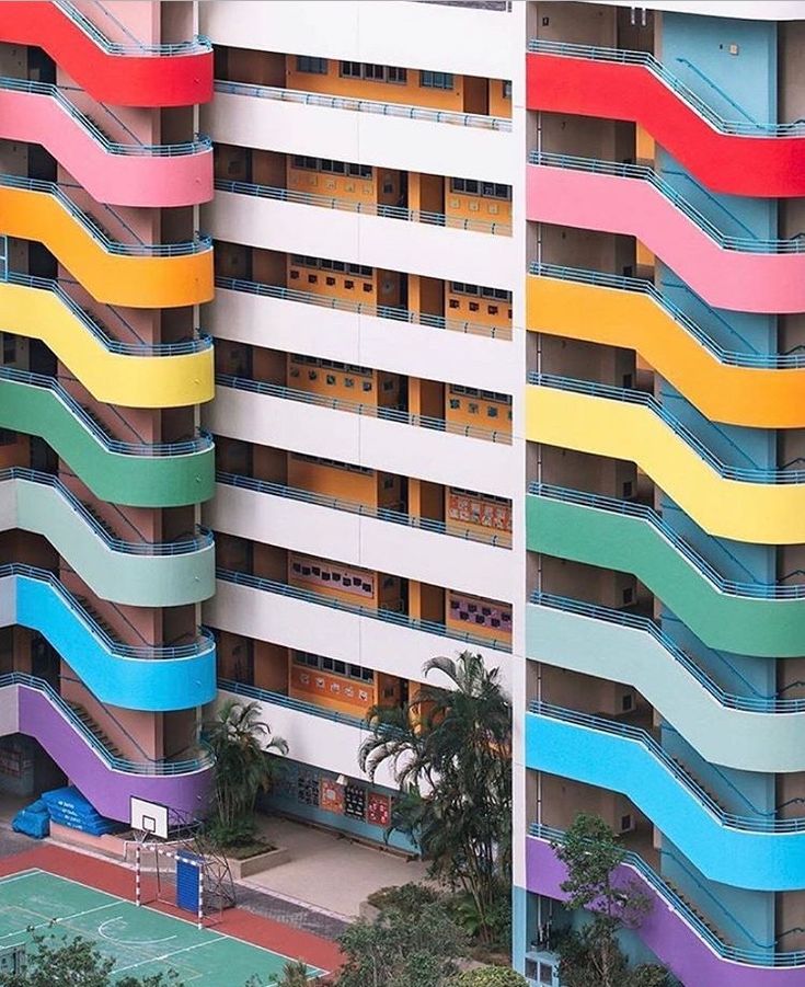 an apartment building with multicolored balconies