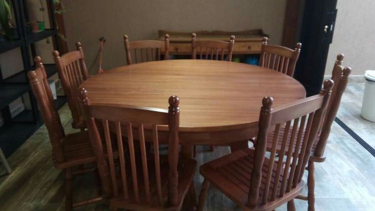 a wooden table and chairs in a room