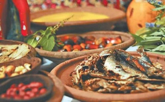 several bowls filled with different types of food