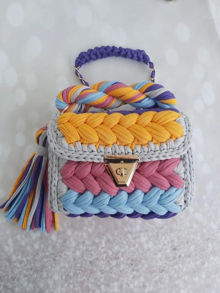 a multicolored handbag hanging on a wall