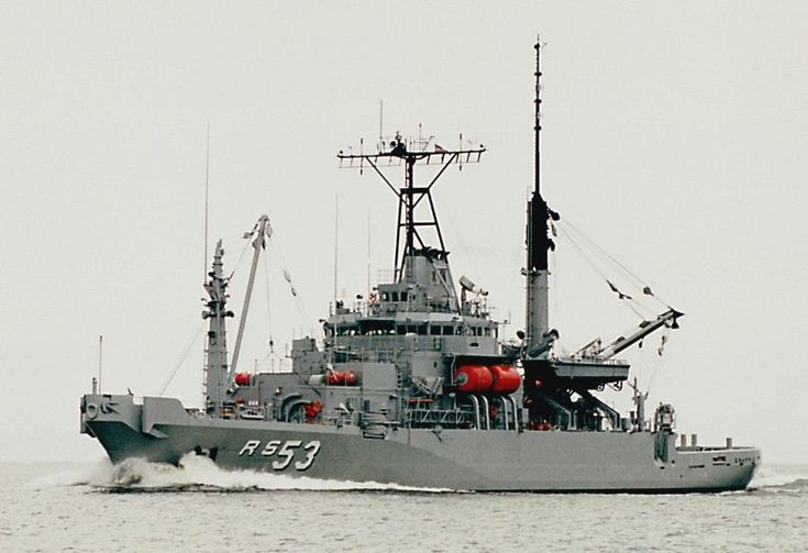 a large gray boat in the water