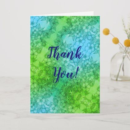 a card with the words thank you in blue, green and yellow colors on it