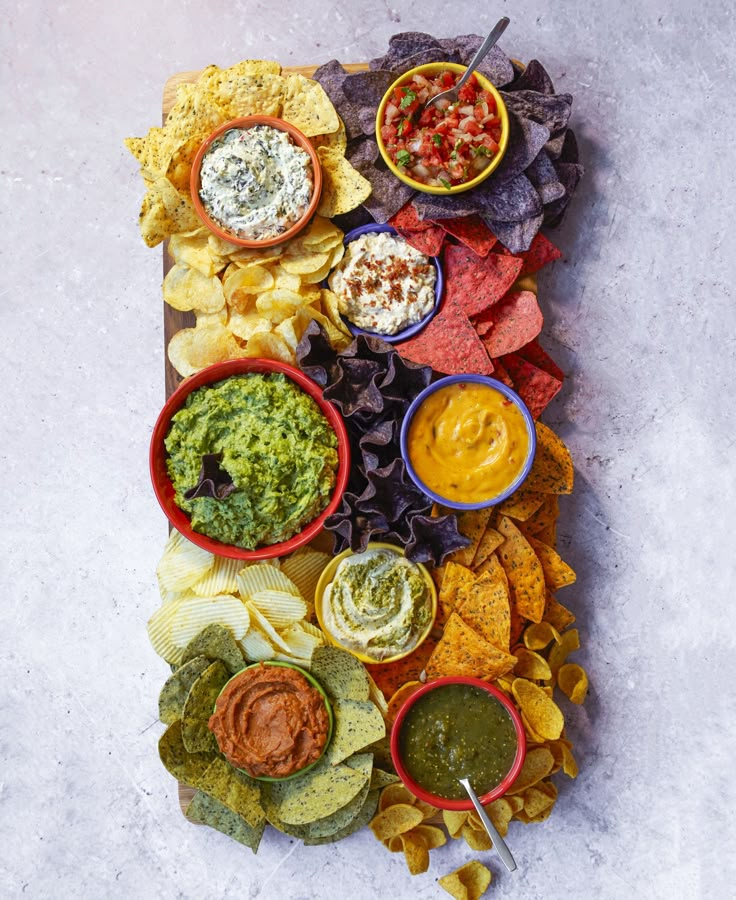 an image of a platter with chips and dips