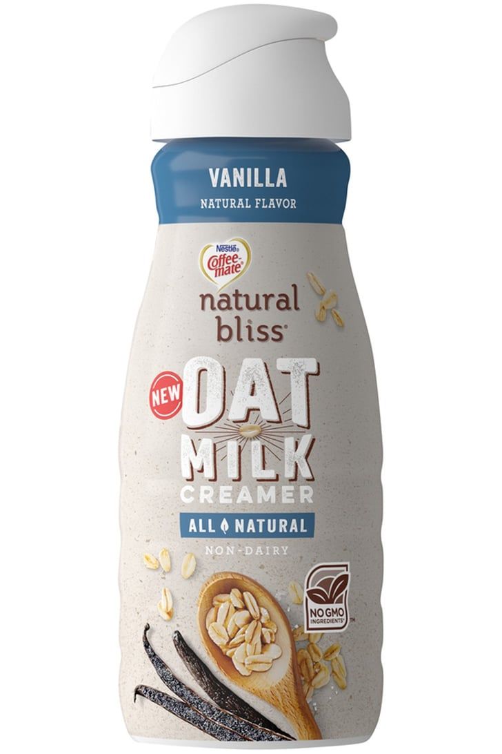 a bottle of oat milk on a white background