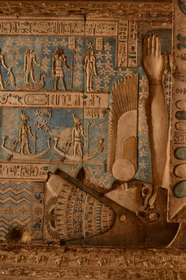 an ancient egyptian wall painting with various symbols and figures on it's sides, including two hands reaching up to the ceiling