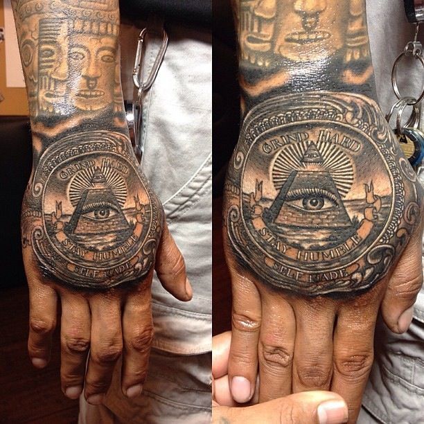 two hands that have tattoos on them, one with an all seeing eye and the other with