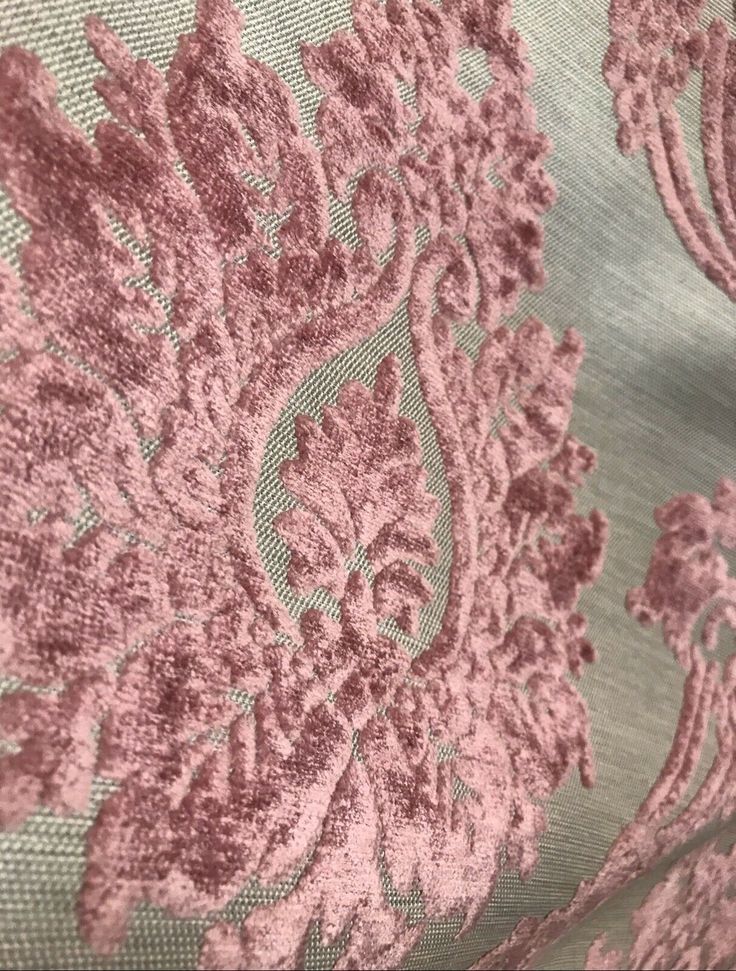 pink and grey fabric with large floral design on the bottom, in very close up