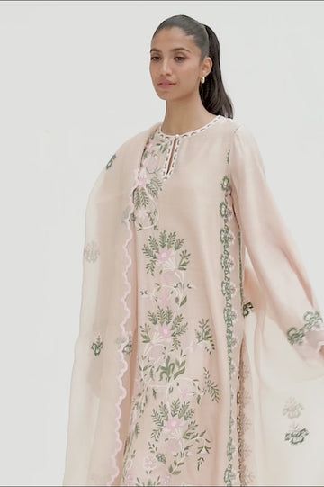 This timeless long shirt silhouette is cut from khaddi silk and is rendered with our signature floral embroidery. An organza dupatta with worked borders and rawsilk trousers complement the look. Spring Floral Embroidered Cotton Silk Anarkali Set, Spring Resham Embroidery Tissue Silk Kurta, Spring Floral Embroidery Raw Silk Palazzo Set, Spring Embroidered Tissue Silk Kurta, Spring Anarkali Tissue Silk Kurta, Spring Tissue Silk Kurta With Resham Embroidery, Spring Designer Tissue Silk Kurta, Designer Tissue Silk Kurta For Spring, Spring Silk Sharara With Dupatta