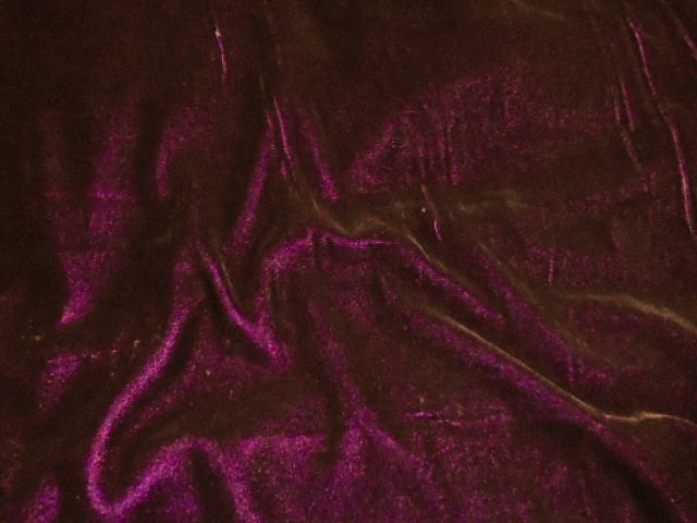 a close up view of a shiny purple material