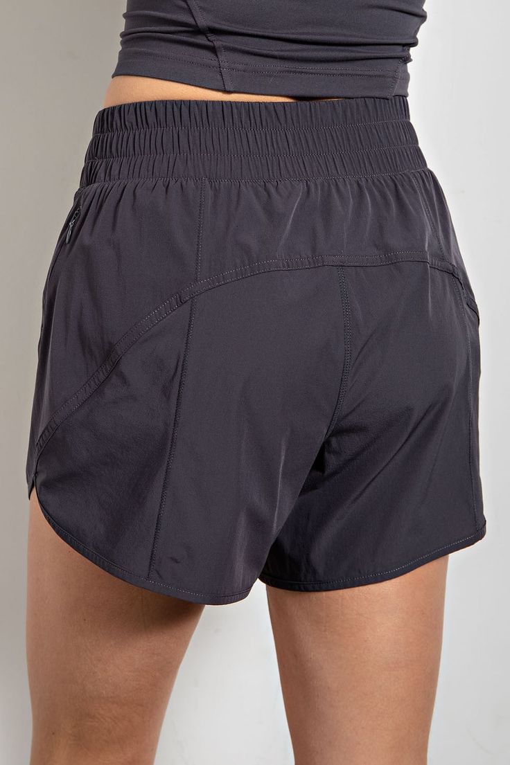 Flex into fashion with these totally swanky Amber High Rise Exercise Shorts in Charcoal! Whether you're at the gym or out on the town, these shorts will keep you looking fab. Feel as comfy as possible while you flex and break a sweat in them. Casual Athletic Shorts With Comfort Waistband For Yoga, Casual Yoga Athletic Shorts With Comfort Waistband, Workout Shorts With Comfort Waistband, Comfort Waistband Nylon Shorts, Solid Short Athleisure Bottoms, Training Bottoms With Pockets And Short Length, Gym Shorts With Comfort Waistband, Casual Athletic Shorts With Short Inseam For Yoga, Sportswear High-waisted Shorts With Go-dry Technology