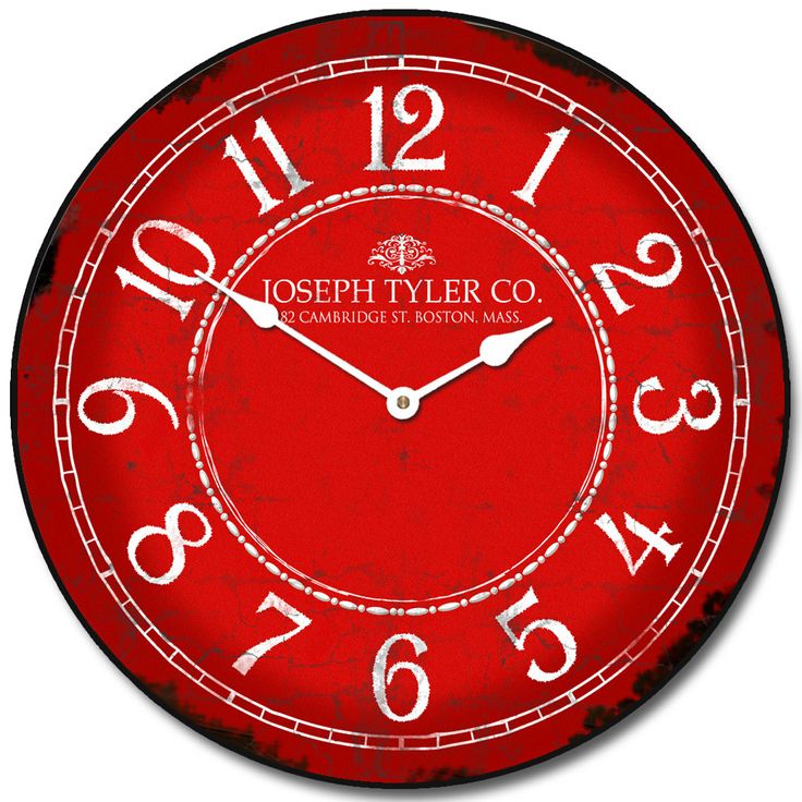 a red clock with white numbers on the front and back of it's face