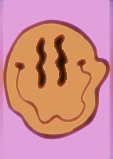 a cookie with chocolate icing on it sitting in front of a pink background