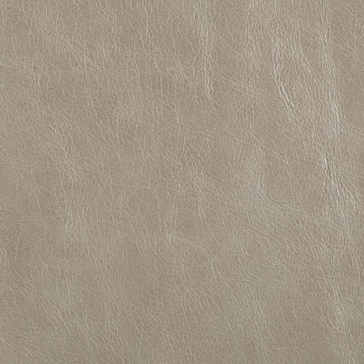 a close up view of a light brown leather texture