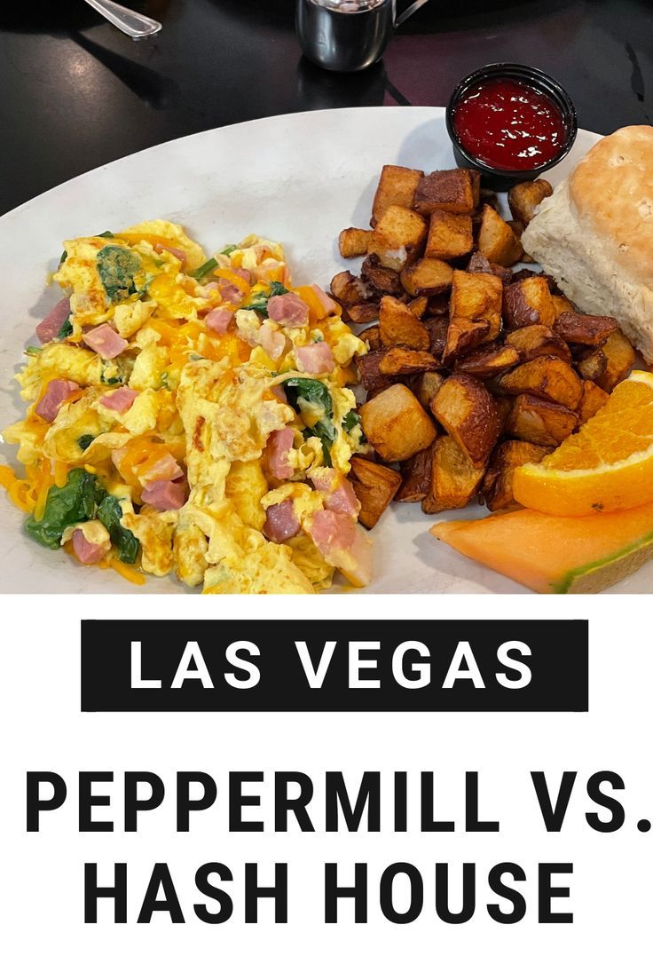 a white plate topped with eggs, hash browns and other breakfast foods next to a cup of ketchup