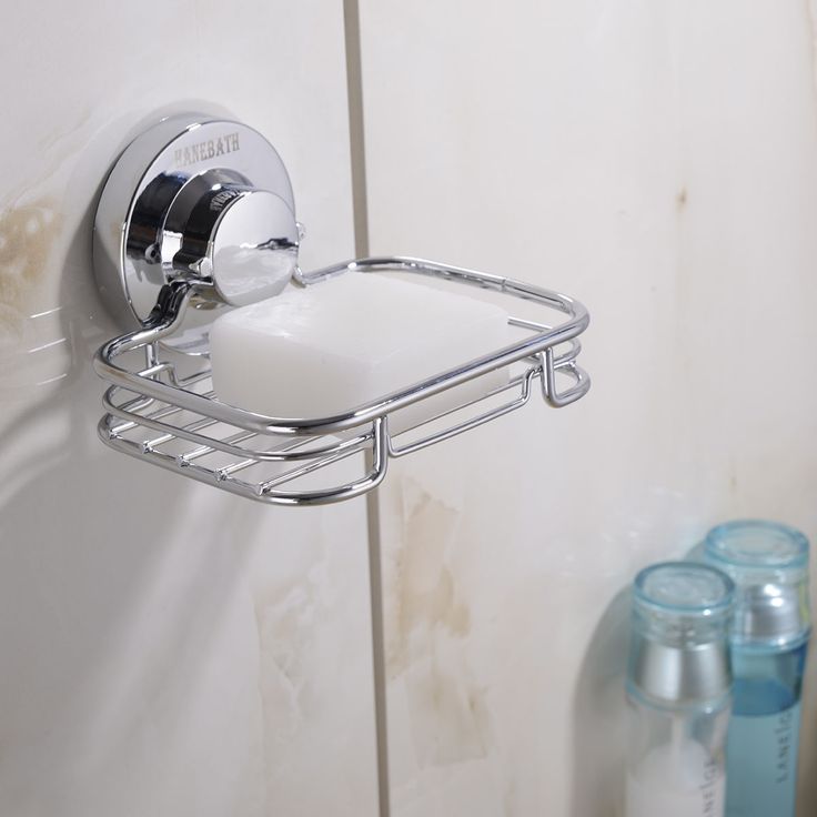 there is a soap dispenser in the corner of this bathroom wall shelf