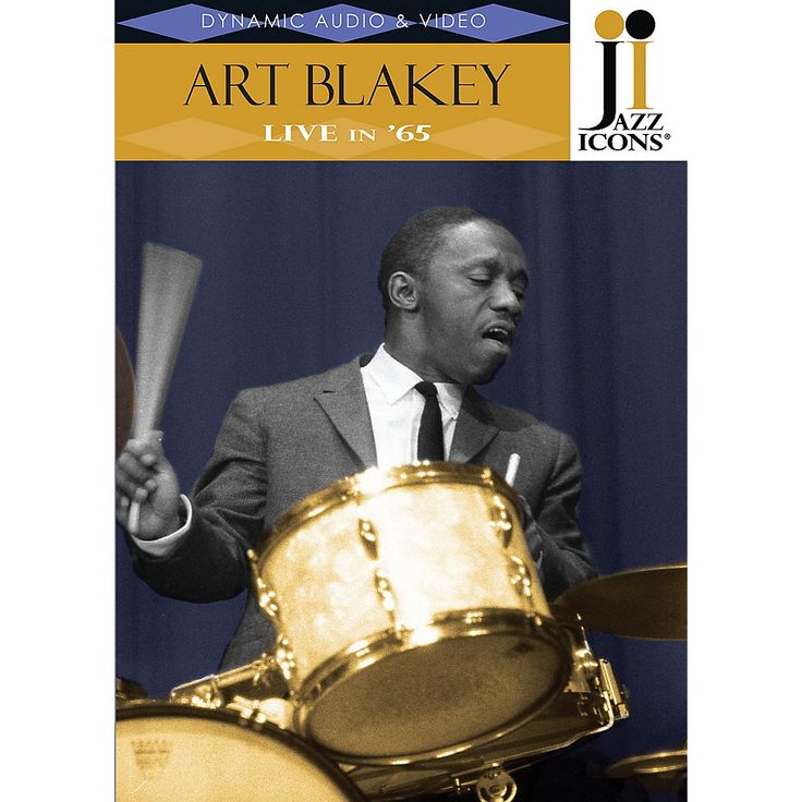 a man in a suit and tie holding two sticks next to a drum set with the words art blakky on it