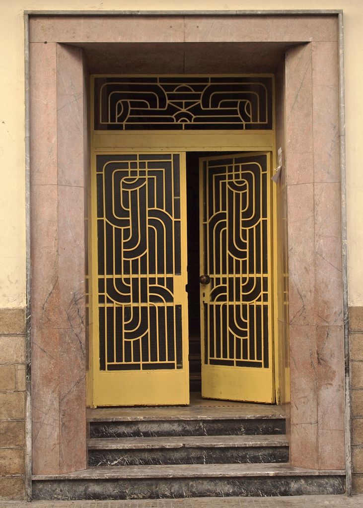 an image of two doors on the side of a building