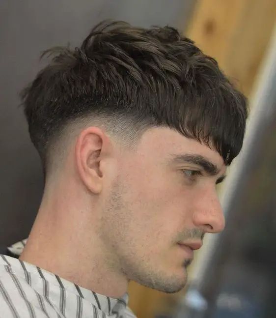 Textured Fringe Haircut: 5 Styles to Try Mens Hairstyles Medium Straight Undercut, Disconnected Haircut Mens, Side Cute Hairstyles Men, Medium Length Tapered Hair Men, Medium Fade Mens Haircut, Faded Haircut For Men Medium Long, Medium Haircut Men Undercut, Skin Fade Long On Top, Side Fade Haircut Men