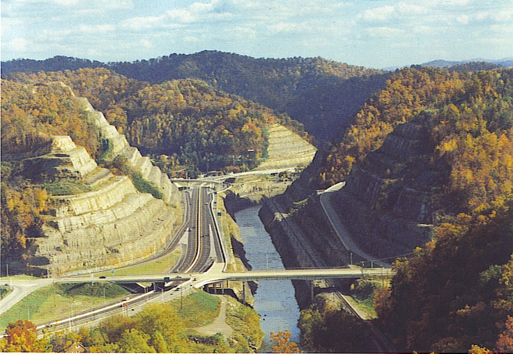 an aerial view of a highway going over a bridge