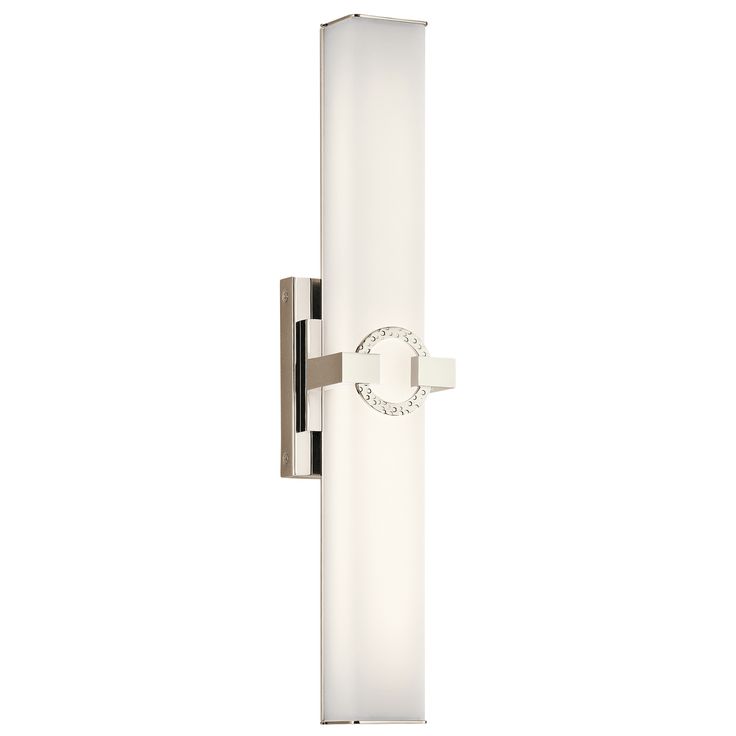 a wall light that is on the side of a white wall with a circular handle