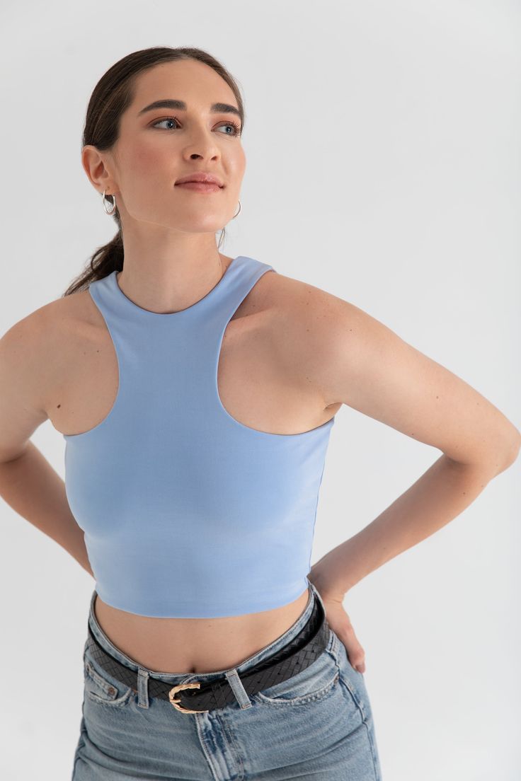 Your favorite fabric, now in tank form. Designed with our Magic Double-Knit Cupro fabric for a soft feel against your skin and a body-hugging fit. Made to be versatile for light workouts and lounging at home. Or for a more elevated look, style with jeans, jewelry, and a heel. High Stretch Racerback Top With Built-in Bra, Casual Tank Top With Built-in Bra And Supportive Fit, Fitted Crop Top With Built-in Bra For Light Exercise, Elastane Tops For Light Exercise And Athleisure, Fitted Sleeveless Sports Bra For Light Exercise, Sporty Stretch Tank Top With Built-in Bra, Blue Seamless Activewear, Seamless Elastane Tops For Light Exercise, Casual Crop Top With Built-in Bra For Pilates