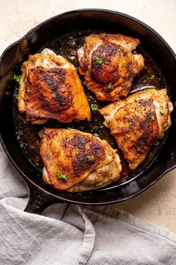 some food is cooking in a skillet on the table and ready to be eaten