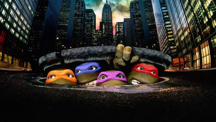 the teenage mutant turtles are in front of a large cityscape with skyscrapers